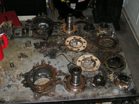 1986 Toyota Hilux - Axle parts laid out on a table, suggesting a rebuild or repair process.