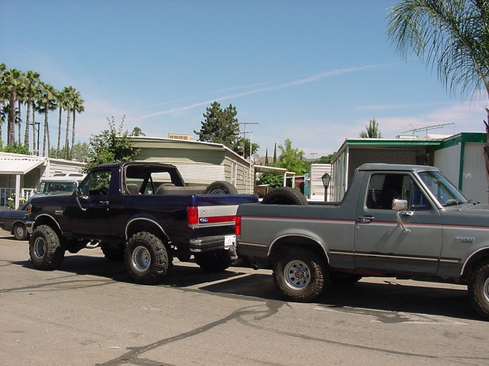 1989 Ford Bronco side view, dark blue and gray