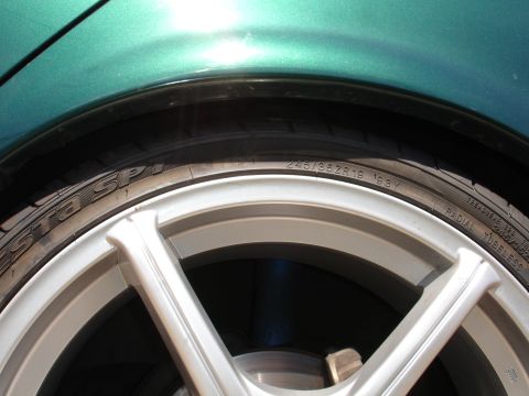 1993 Ford Taurus - Tire sidewall shows '1993' and size 245/35ZR19, mounted on a silver wheel.
