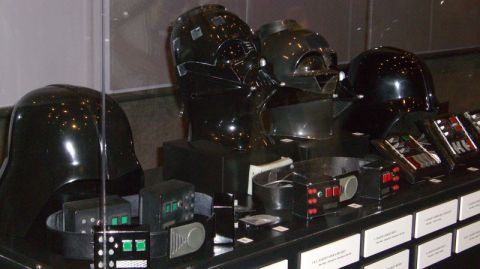 1990 Ford Probe - Display of iconic Star Wars villain Darth Vader's helmets and belt components.