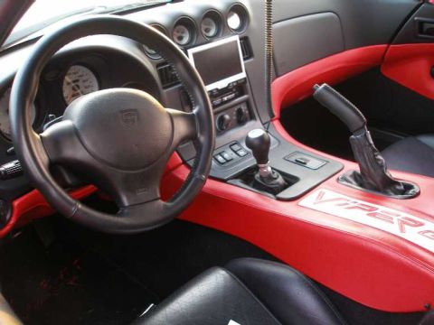 1998 Ford Crown Victoria - The interior of a Dodge Viper features a manual transmission and prominent Viper badging.