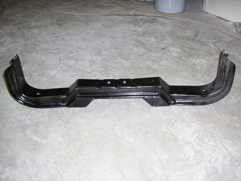 1979 Ford F-350 - This black metal bumper part is shown on a concrete floor. The registry claims it is from a 1979 Ford F-350.