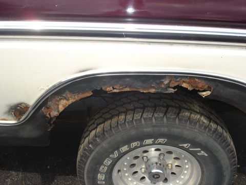 1979 Ford Bronco - Significant rust damage is visible around the wheel well of this vehicle.