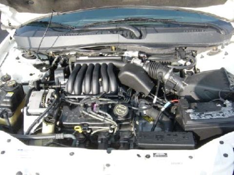 1991 Ford Taurus - picture 2 of the composite upper intake I'll get better performance with it.I might not need a pholic spacer with this intake also.