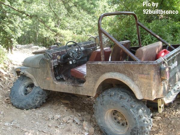Trash on the trail! Our entrance to the Rubicon was blocked by this abandoned Heep, whose LHF steering knuckle was no longer attached to the axle housing. We did him the favor of pulling it back up to level ground. Unfortunately, his LHR tire came off the rim in the process, and the LHF tie rod end separated. Sorry, but I doubt he could have gotten it out of there in any better condition.