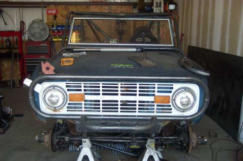 1992 Ford Mustang - This 1974 Ford Bronco is in the process of being modified, a visible roll cage and custom front bumper.