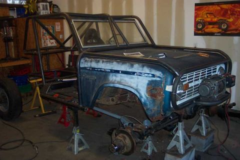 1992 Ford Mustang - This Ford Bronco is undergoing a build, a custom roll cage and a winch installed on the front bumper.