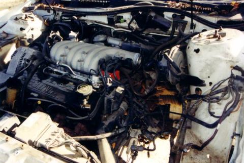1991 Ford Taurus - heres my volcan v6 and the tranny out. RIGHT NOW THE MANUAL TRANNY'S INSTALLED.