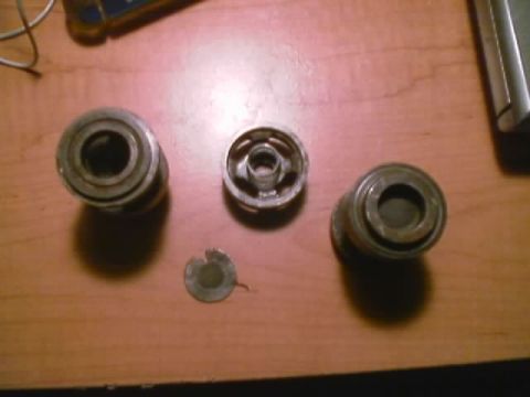 1989 Ford Bronco - These metal parts do not appear to be related to a 1989 Ford Bronco's rock sliders or air tank.