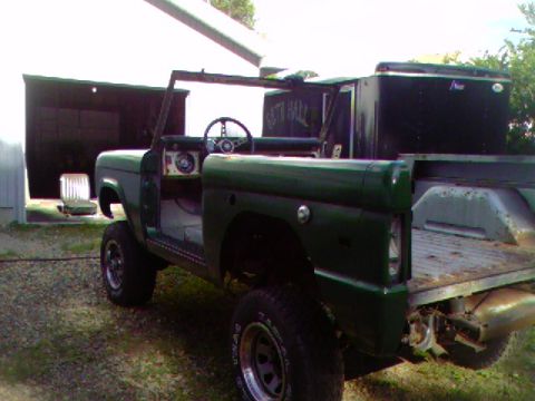 1974 Ford Bronco - This 1974 Ford Bronco is seen in a dark green paint color with its doors removed.