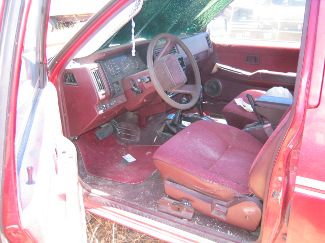 Red truck interior with maroon seats and dashboard
