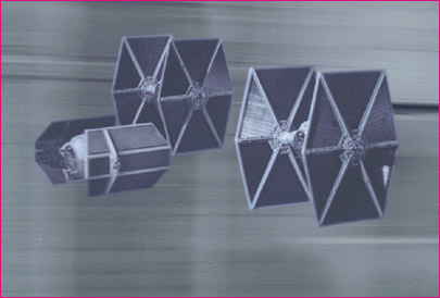 1991 Ford Taurus - Four TIE fighters from Star Wars are shown in a formation. The image has a watermark.