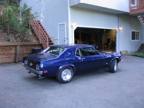 1973 Ford Ranchero - Blue 1970 Ford Mustang coupe parked in a driveway.