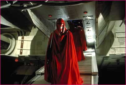 1991 Ford Taurus - Imperial Royal Guards in their distinctive red robes stand on a ramp inside a spacecraft.