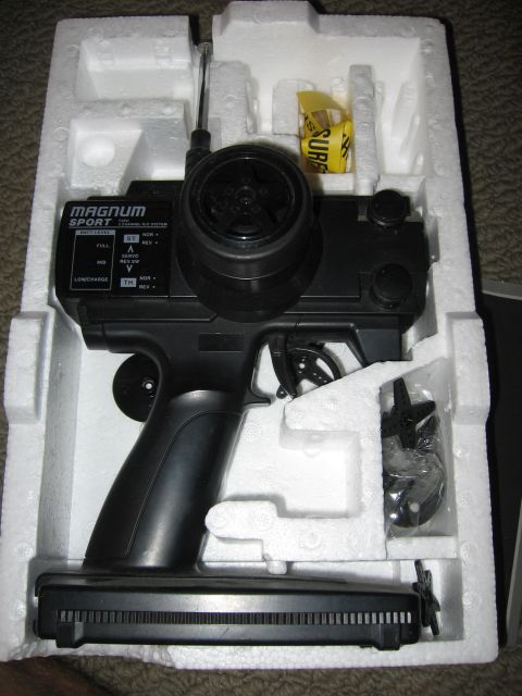 1974 Ford F-100 - Radio control transmitter in its original packaging, with 'Magnum Sport' branding visible.