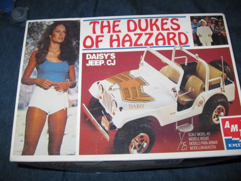 1974 Ford F-100 - Box art for The Dukes of Hazzard Daisy's Jeep CJ scale model kit, Daisy Duke and the iconic vehicle.