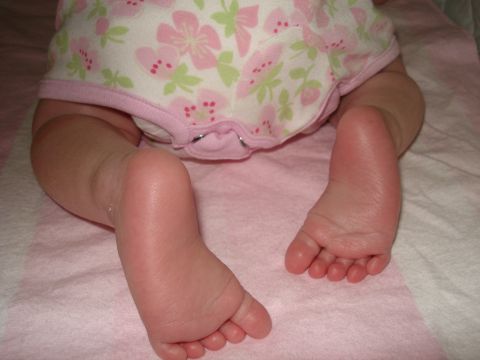 2000 Ford Crown Victoria - The image shows a close-up of a baby's feet and legs.