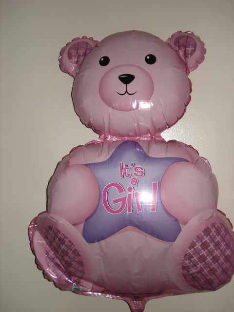 2000 Ford Crown Victoria - A pink teddy bear balloon with a star decoration is shown against a white wall.
