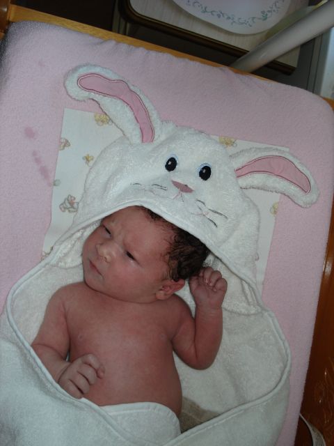 2000 Ford Crown Victoria - Baby dressed in a bunny towel, looking to the side.