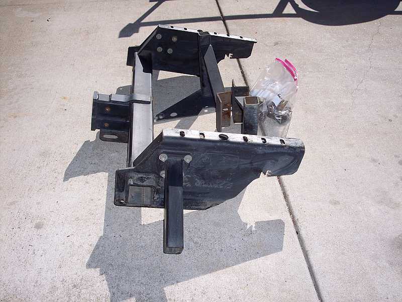 Torklift hitch receiver assembly with a bag of hardware on concrete