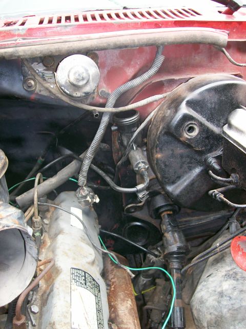 1982 Ford Bronco - Engine bay components including brake booster and valve cover are shown in this close-up view.