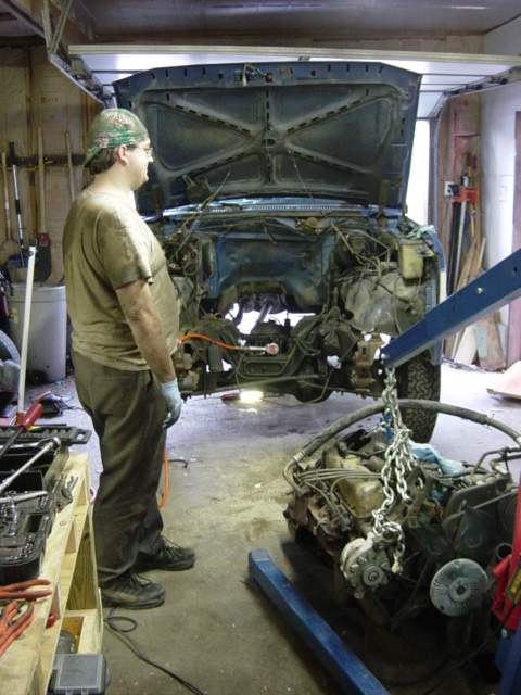 1985 Ford F-250 - Engine removal in progress on a Ford truck, likely from the early 1980s.
