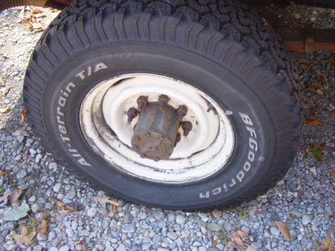 1985 Ford F-250 - A close-up view of a tire and wheel assembly, showing the tread pattern and rim details.