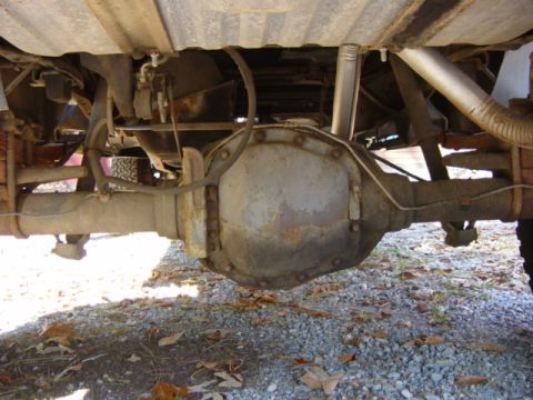 1985 Ford F-250 - Close-up of the rear axle and suspension components on a truck.