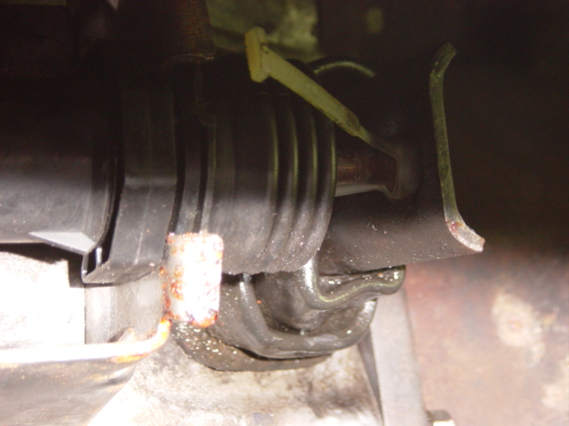 Close-up of a rubber boot and metal bracket