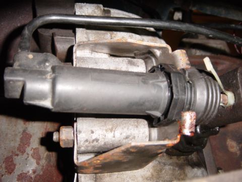 1985 Ford F-250 - This photo shows a close-up view of a vehicle's clutch slave cylinder, a critical part of the manual transmission system.