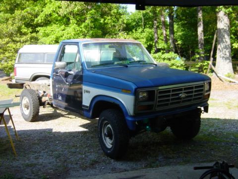 1985 Ford F-250 - This 1980 Ford F-250 pickup truck is missing its bed and appears to be undergoing some form of reassembly or modification.