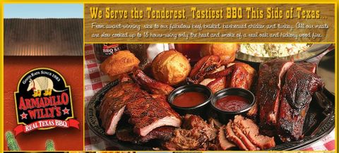 1990 Ford Bronco - A generous platter of slow-cooked BBQ meats including ribs, brisket, and chicken, served with sides and sauces.