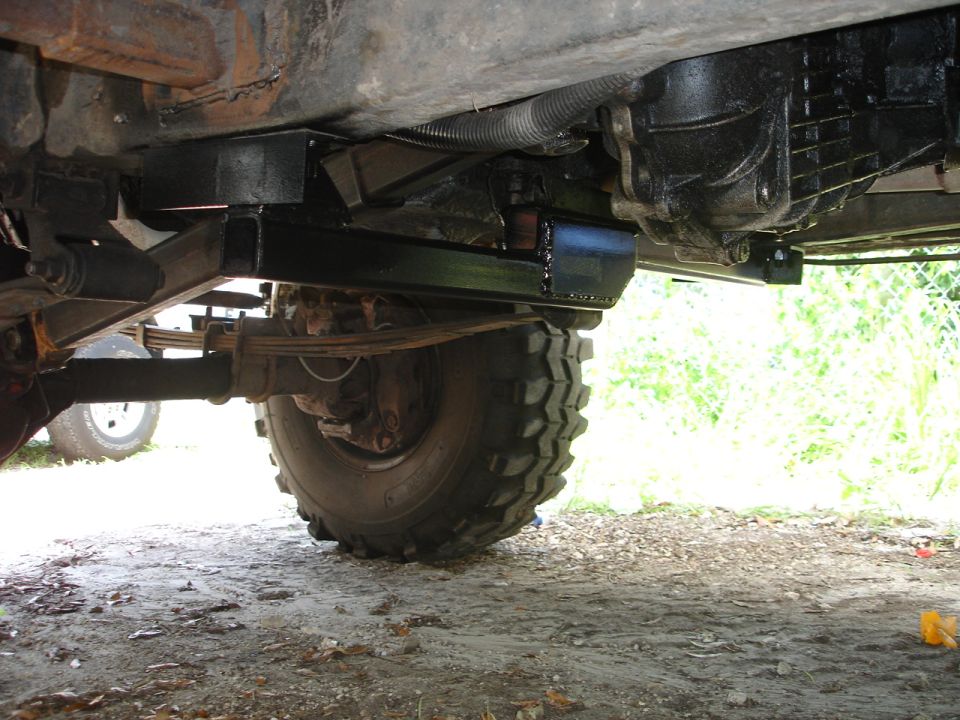 view of the undercarriage, showing a reinforced crossmember and transmission housing