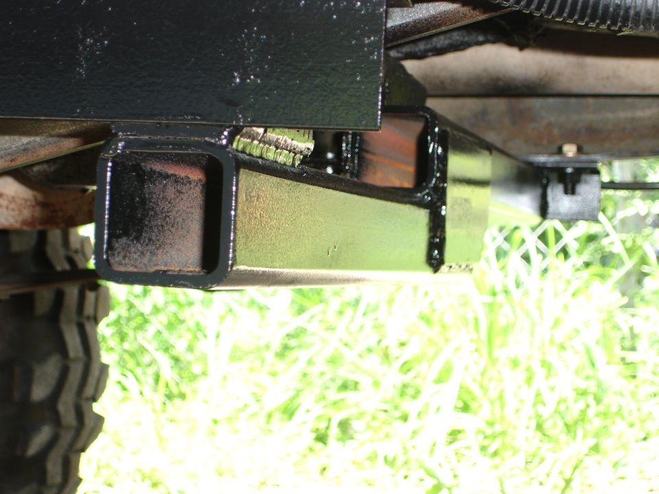 close-up of vehicle frame with a hitch receiver attached