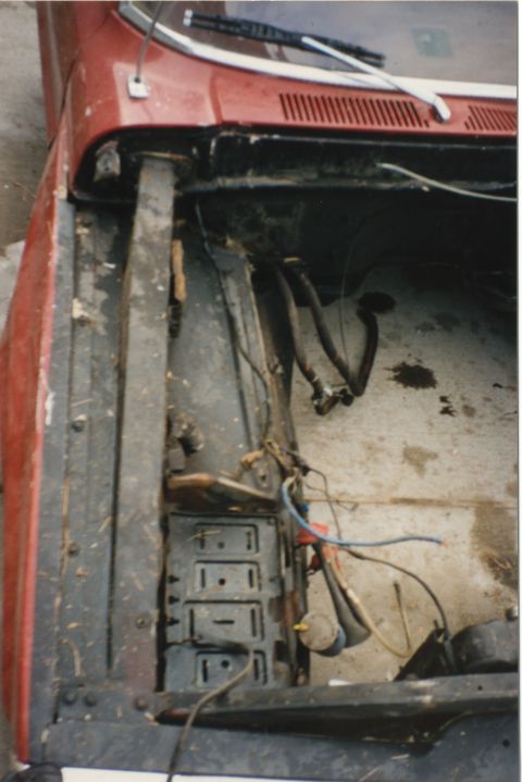 1967 Ford F-100 - The engine bay of a vehicle appears to be undergoing disassembly or repair.