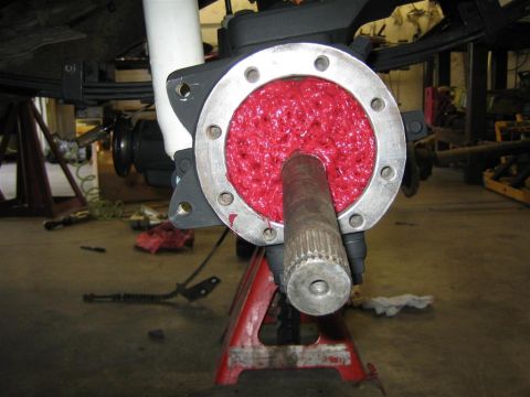 1987 Suzuki Samurai - A vehicle's front axle hub is shown packed with red grease, ready for reassembly.