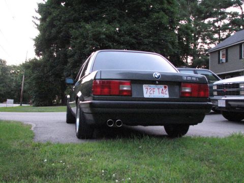 1989 BMW 3 Series - This 1989 BMW 3 Series sedan is parked in a driveway next to another vehicle.