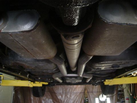 1992 Ford Crown Victoria - Undercarriage shot showing the dual exhaust system and driveshaft of a vehicle.