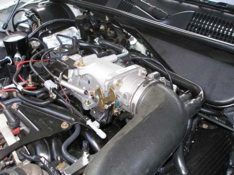 2001 Ford Crown Victoria - The "new" stock TB, plenum, and sensors, installed less than 3000 miles ago.