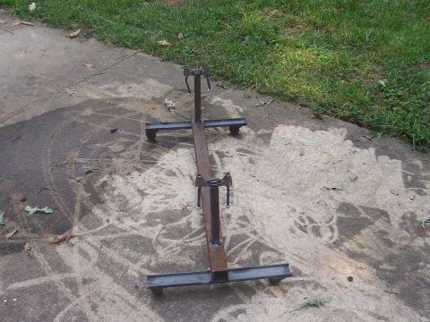 1979 Ford Bronco - This metal axle stand, designed for supporting vehicle axles, is shown resting on a concrete surface.