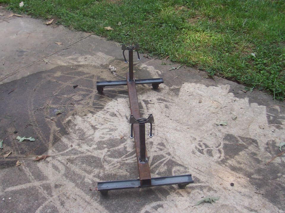 Metal axle stand with wheels on concrete
