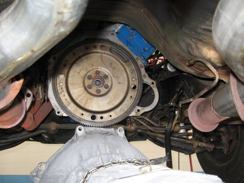 1973 Ford Ranchero - Close-up view of a vehicle's transmission and flywheel assembly, showing mechanical components.