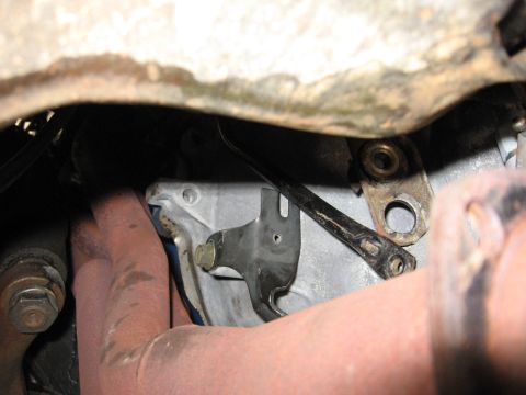 1973 Ford Ranchero - Underside view of vehicle mechanical parts, likely transmission and exhaust system.