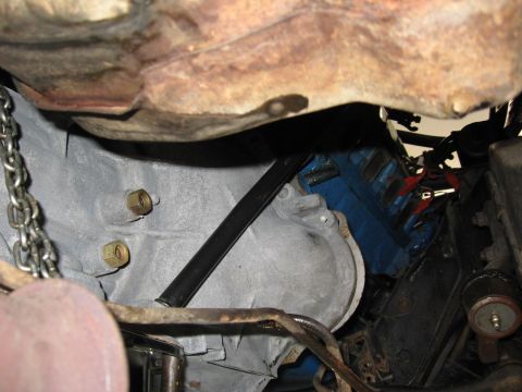 1973 Ford Ranchero - Close-up view of vehicle transmission and engine components, showing a blue engine block and grey transmission housing.