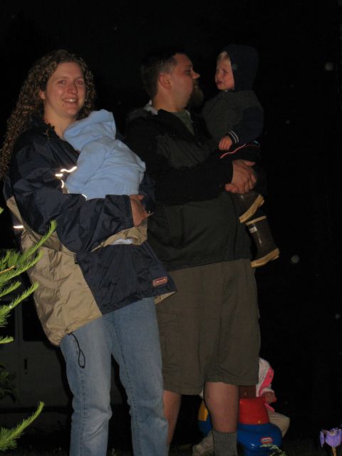 2000 Ford E350 - A family poses for a photo at night with their children.