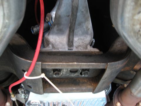 1973 Ford Ranchero - Close-up of vehicle undercarriage showing transmission and exhaust components.