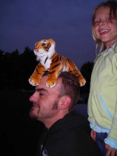 2003 Jeep TJ - A man and a young girl pose for a photo with a stuffed tiger on the man's head.