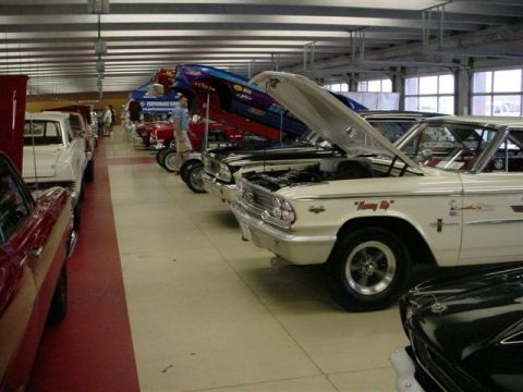 1972 Ford Ranchero - Several classic cars are displayed indoors with their hoods open, including a white 1962 Ford Galaxie.
