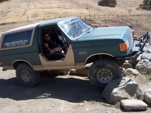 1991 Ford Bronco - This modified 1991 Ford Bronco is shown tackling a rocky trail with its doors removed.
