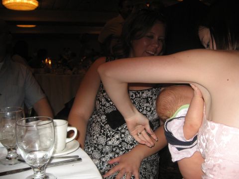 1988 Ford Bronco - A group of people are seated at a table, with a baby being held.